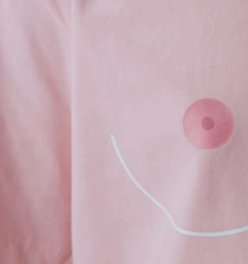 Proactive Support - Close-up of a pink shirt highlighting breast cancer awareness with conceptual design.