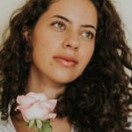 Appreciation Programs - Portrait of Brunette Woman Holding Pink Rose