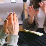 Resolution - Two women engaged in a therapy session, communication and support in an office setting.