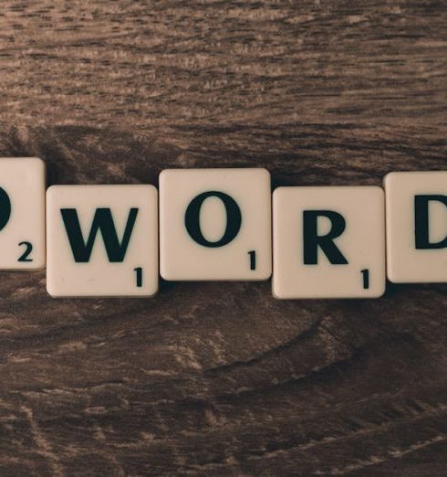 SEO - Scrabble tiles spelling 'AdWords' on a wooden surface, symbolizing digital marketing concepts.