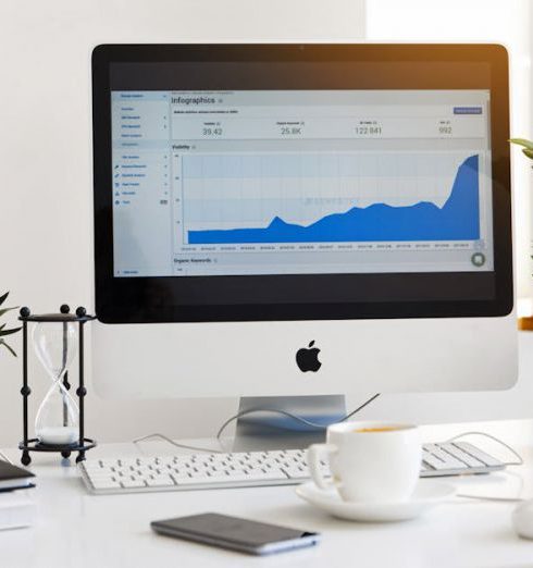 Analytics - Silver Imac Displaying Line Graph Placed on Desk