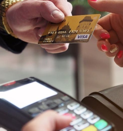 Payments - Close-up of a credit card payment being processed at a POS terminal.