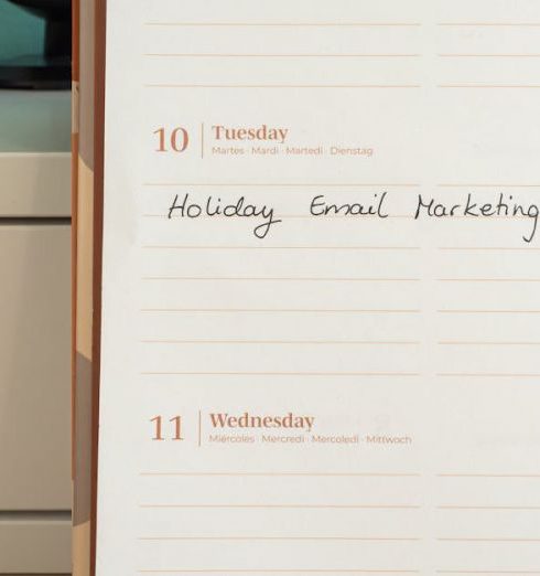 Email Marketing - Planner open on a desk with handwritten 'Holiday Email Marketing Series' note.