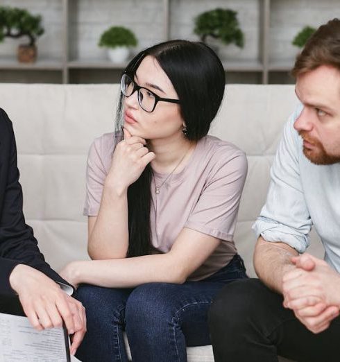 Customer Reviews - Three adults discussing business inside, focused on cooperation and strategy.