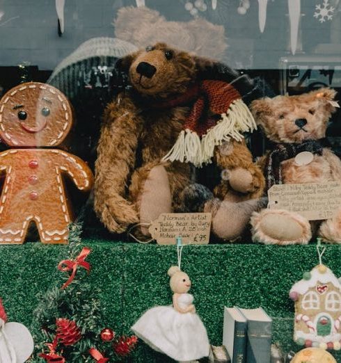 Holiday Sales - Festive store window showcasing Christmas decorations, toys, and ornaments.