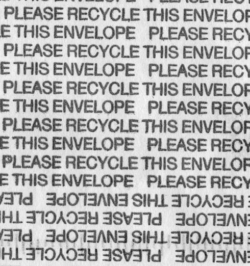 Sustainable Materials - Close-up of Lines of Text Saying "Please Recycle This Envelope"