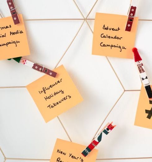 Email Marketing - Sticky notes with holiday marketing ideas clipped to a wall grid.