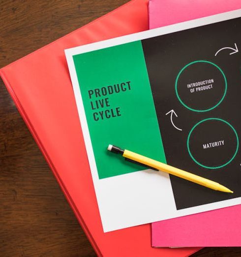 Sales Cycle - Flat lay of a product lifecycle illustration with a pencil and folders, ideal for business presentations.