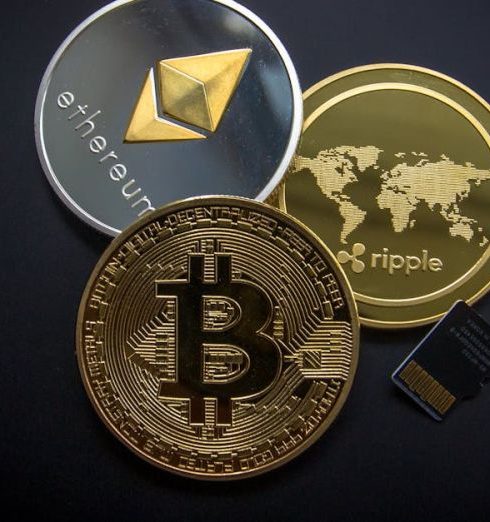 Cryptocurrency - A striking image of Bitcoin, Ethereum, and Ripple coins illustrating modern digital currency.