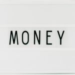 Index Funds - Close-up of a Light Box with a Word "Money" in the Middle