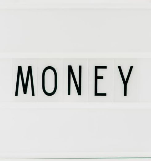 Index Funds - Close-up of a Light Box with a Word "Money" in the Middle