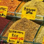 Options - A colorful array of spices and teas displayed in a market stall, showcasing variety and freshness.