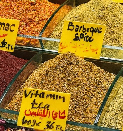 Options - A colorful array of spices and teas displayed in a market stall, showcasing variety and freshness.