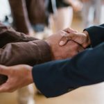 Venture Capital - Close-up of two businesspeople shaking hands, symbolizing agreement and partnership.