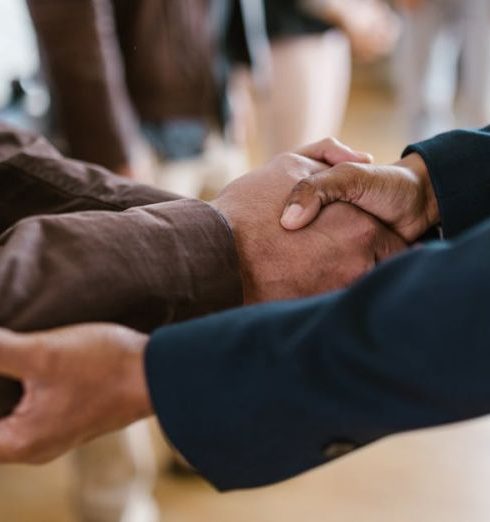 Venture Capital - Close-up of two businesspeople shaking hands, symbolizing agreement and partnership.