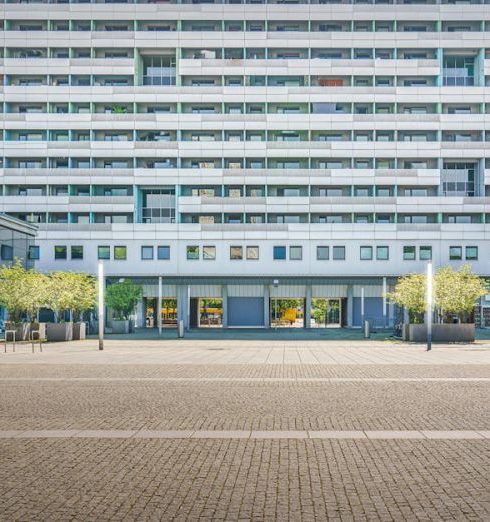 Real Estate Flipping - Contemporary building facade in Dresden, Germany on a sunny day.