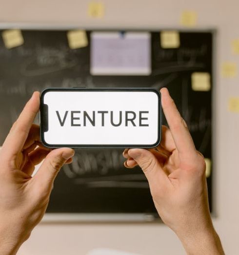 Venture Capital - A Person Holding a Smartphone