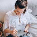 Flexible Work - Woman Working on a Tablet in her Living Room