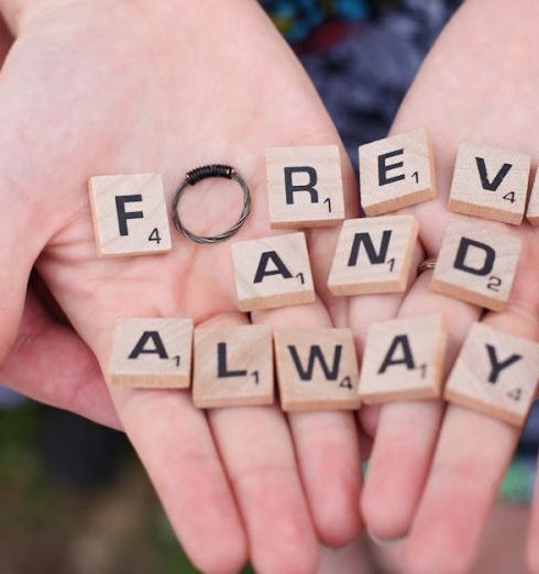 Engagement - Hands holding 'forever and always' in Scrabble letters, symbolizing eternal love.