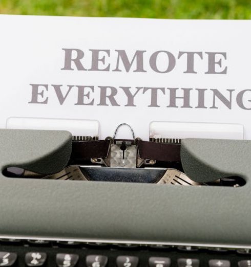 Remote Teams - Retro typewriter displaying 'Remote Everything' in an outdoor setting, symbolizing digital transformation.