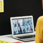 SWOT Analysis - Woman engaged in a video call in an office workspace, highlighting remote work dynamics.