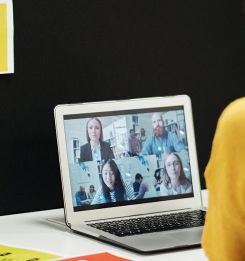 SWOT Analysis - Woman engaged in a video call in an office workspace, highlighting remote work dynamics.