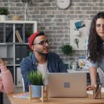 Team Goals - Office Workers Holding a Discussion