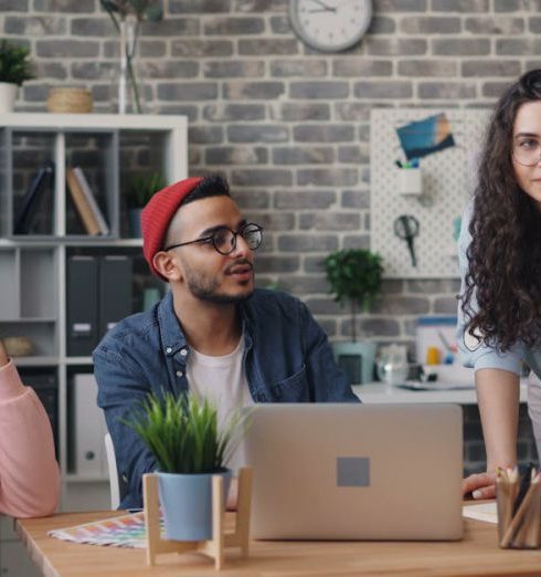 Team Goals - Office Workers Holding a Discussion