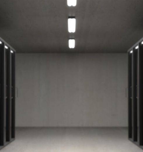 Data - Spacious data center with aligned server racks and LED indicators.