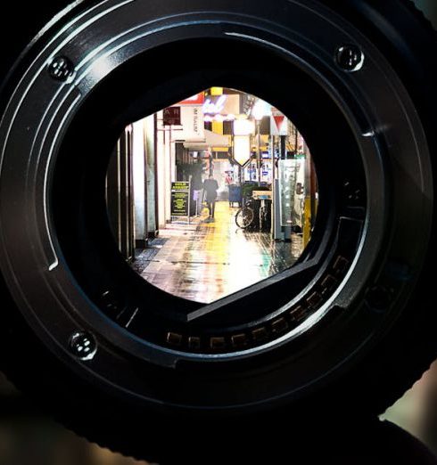 Objectives - A unique perspective of Düsseldorf's city streets seen through a camera lens at night.