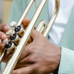 Key Performance Indicators - A detailed view of a musician playing a trumpet on a sunny day.