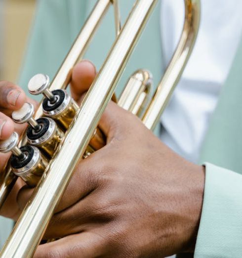 Key Performance Indicators - A detailed view of a musician playing a trumpet on a sunny day.