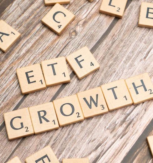 Market Expansion - Wooden tiles spelling ETF growth on a wooden surface, symbolizing investment strategy.