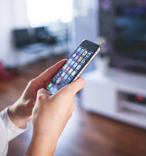 Smart Home - Woman Wearing White V Neck Shirt Using Space Gray Iphone 6