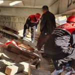 Needs Assessment - Rescue workers in Istanbul inspecting a damaged structure for safety and recovery efforts.