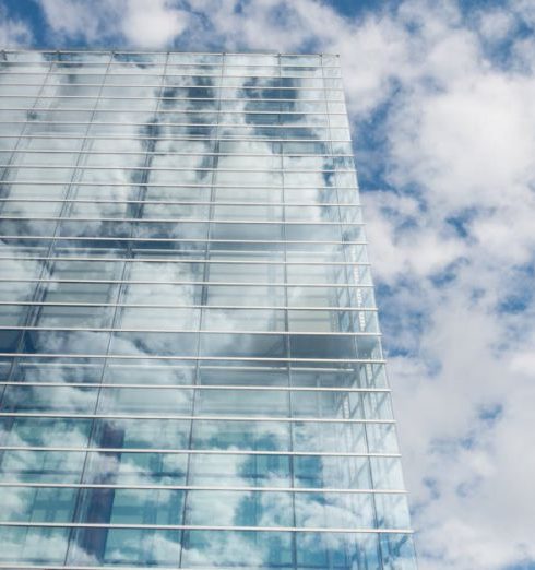 Transparency - Bottom View of Clear Glass Building Under Blue Cloudy Sky during Day Time