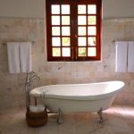 Bathroom Tiles - White Bathtub on White Tile Bathroom Near Brown Framed Clear Glass Window