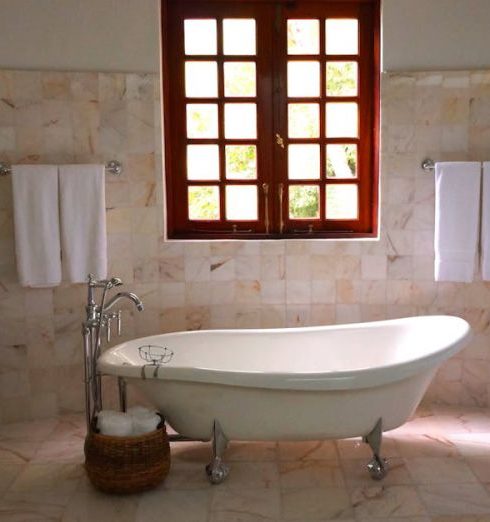 Bathroom Tiles - White Bathtub on White Tile Bathroom Near Brown Framed Clear Glass Window