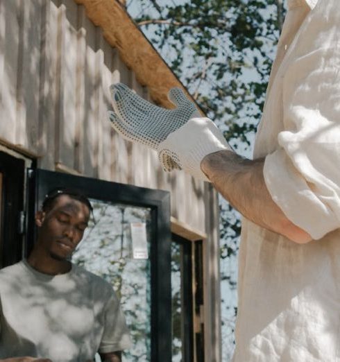 Second Story - Men Building a Wooden Cabin in a Forest