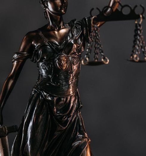 Ethics - Elegant bronze Lady Justice statuette symbolizing law and justice.