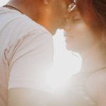 Engagement - Man Wearing White Shirt Kissing Woman in Her Nose