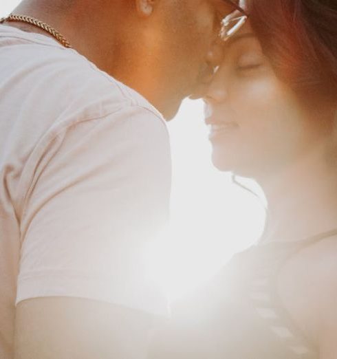 Engagement - Man Wearing White Shirt Kissing Woman in Her Nose