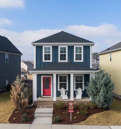 Family-Oriented - Aerial view of charming suburban homes in Wendell, NC, showcasing modern architecture.