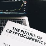 ROI - A detailed look at cryptocurrency market trends using a laptop and analytical document.