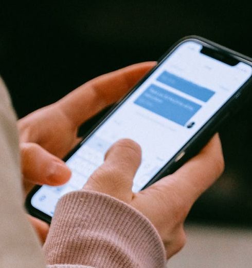 Social Media Data - A person using a smartphone for texting, focusing on their hands and device screen.