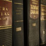 Regulations - Detailed close-up of law and regulation books on a bookshelf, emphasizing education and knowledge.