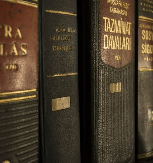 Regulations - Detailed close-up of law and regulation books on a bookshelf, emphasizing education and knowledge.