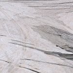 Remote Teams - Stunning aerial view of hikers on the vast Aletsch Glacier in Switzerland.