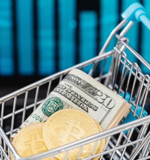 Market Diversification - Symbolic image of cryptocurrency and cash in a shopping cart on a laptop, representing digital finance and trading.