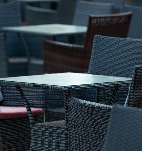 Weather-Resistant Furniture - Tables and Chairs on Cafe Terrace